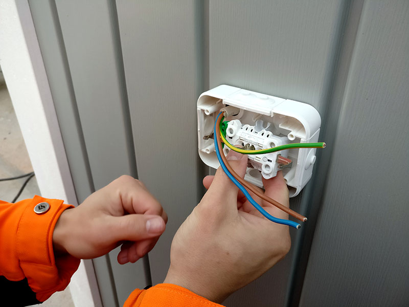 Electrician installing socket